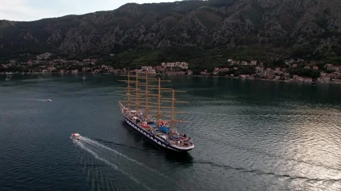 Sailing Ship Gliding Through Scenic Waters Surrounded by Beautiful Mountains Stock Footage 320747532