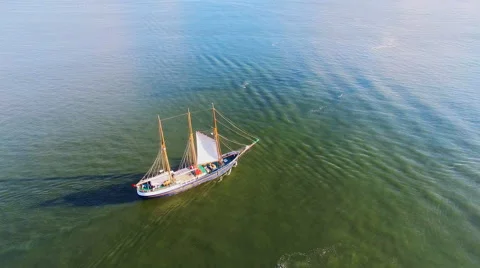 Sailing ship moving ocean sea river calm water. Aerial flight 4k video Stock Footage 65882098
