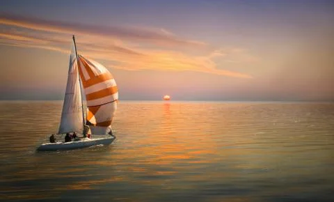Sailing ship sailing in the rays of the setting sun, the golden color of the  Stock Photos