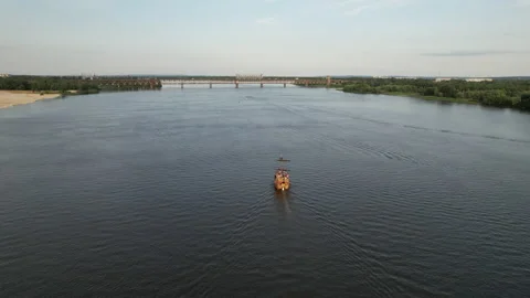 Sailing ship sails on the calm waters along the river bank in sunny weather Stock Footage 156848833