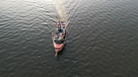 Sailing ship sails on the calm waters along the river bank in sunny weather Stock Footage 156860714
