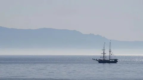 A sailing ship sails with motor and without wind on the calm sea Video stock 89435293