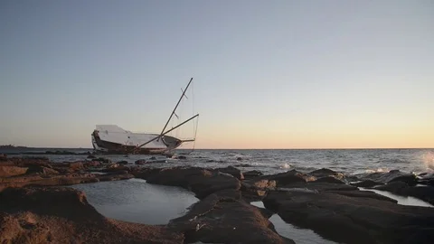Sailing ship stranded on the rocks Stock Footage 80267500