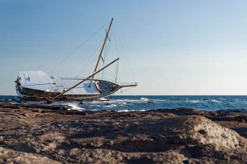 Sailing ship stranded on the rocks 写真素材