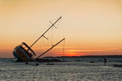 Sailing ship stranded on the rocks Stock Photos