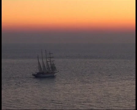 Sailing ship at sunset Stockbeeldmateriaal 378211