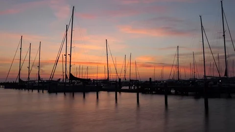 Sailing Ships in the harbor at sunrise - Time Lapse Stock Footage 107002832