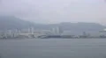 Sailing By The Shoreline And Mountains Of Busan South Korea HD HD Footage