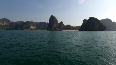 Sailing on a speed boat we see beautiful rocky green islands Stock Footage 126793706