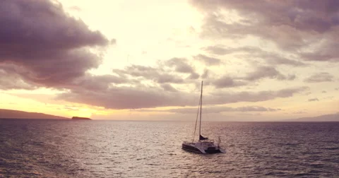 Sailing into the Sunset. Aerial View Flying Over Sail Boat Видео 57133376