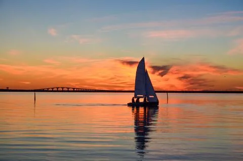 Sailing at sunset Stock Photos