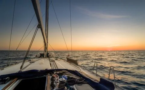 Sailing to sunset Stock Photos