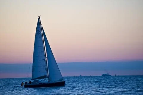 Sailing into the sunset Stock Photos