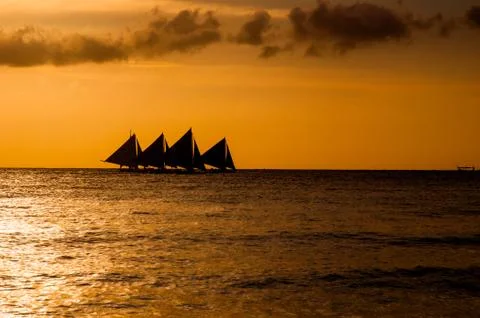 Sailing on sunset Stock Photos