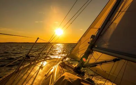 Sailing into sunset Stock Photos