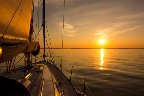 Sailing into the sunset Stock Photos