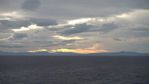 Sailing at sunset through the Mediterranean Stock Footage 100596273