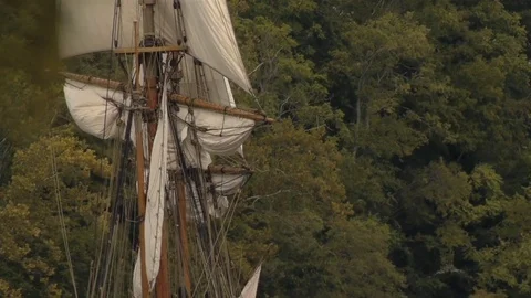 Sailing Tall-Ship, rigging, masts and giant sails on river Video stock 81243736
