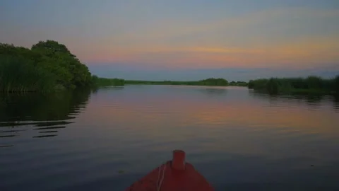 Sailing through calm waters at dawn Stock Footage 293893188