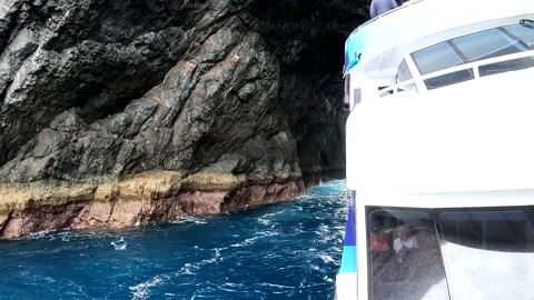 Sailing through the Hole in the rock Stock Footage 238700043
