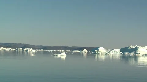 Sailing through smooth Arctic waters with small icebergs, 2-clips-in-one Stock Footage 60141480