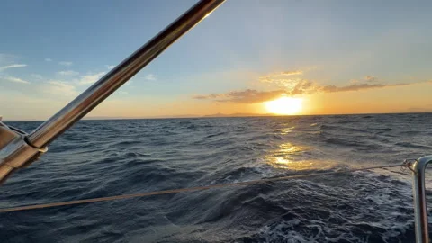 Sailing Through Sunset on Calm Sea Stock Footage 311060133