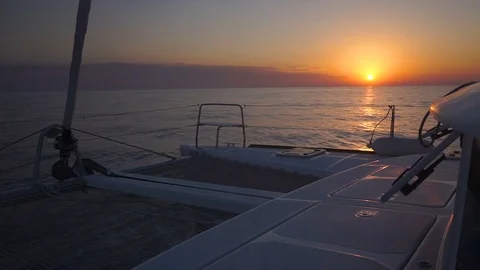 Sailing through the waves of Aegean sea during colourful sunset. Stock Footage 82808102