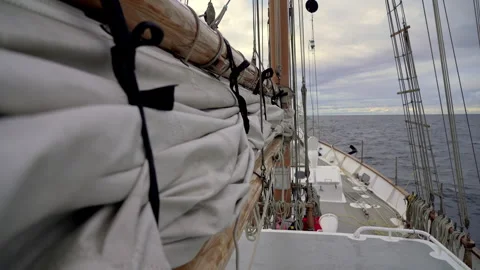 Sailing through the waves. Sailing. Sailing boat at sea. View from the deck. Stock Footage 252038784