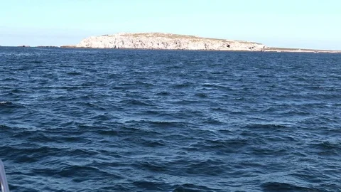 Sailing towards island, part of bow in the corner Stock Footage 78072777