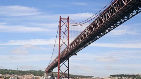 Sailing under the 25th of April Bridge on sky background Lisbon Portugal Stock Footage 64579176