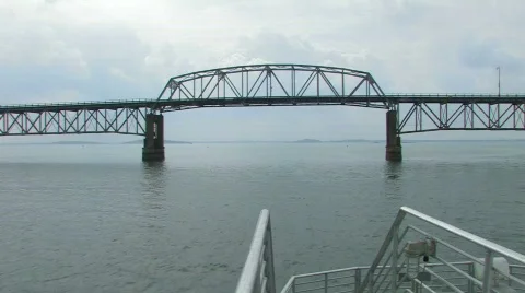 Sailing under bridge Stock Footage 558423