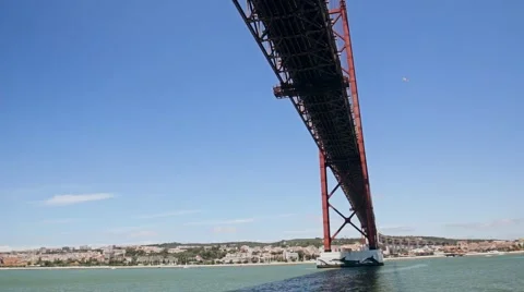 Sailing under the Bridge on sky background Lisbon Portugal Stock Footage 64578690