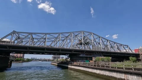 Sailing Under the Madison Avenue Bridge in NYC on the Harlem Meer Timelapse Stock Footage 219162572