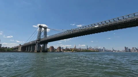 Sailing under NYC's Williamsburg Bridge Along the East River Timelapse Stock Footage 219162384