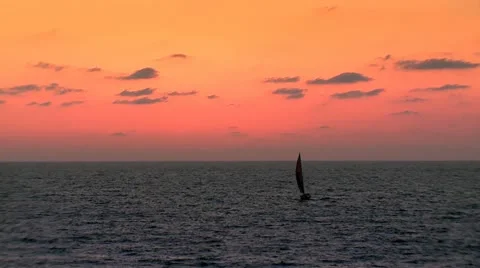 Sailing under Orange Sky Stock Footage