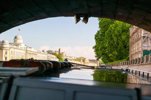Sailing under the stone bridge Stock Photos