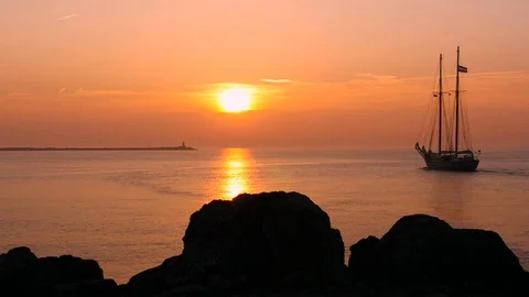 Sailing vessel at sunset  Stock Footage 74333572