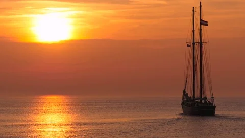 Sailing vessel at sunset  Stock Footage 74333634
