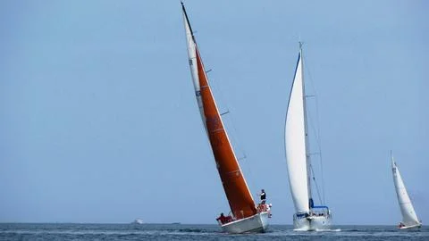 Sailing in the wind through the waves at the Sea. Stock Photos