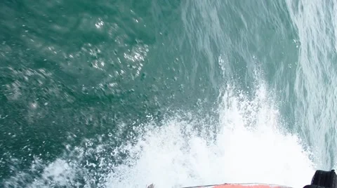 Sailing in the wind through the waves on sunny day in summer with water splas Stock Footage 64126200