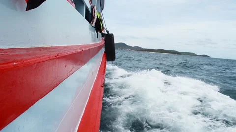 Sailing in the wind through the waves on sunny day in summer with water splas Stock Footage 64126227