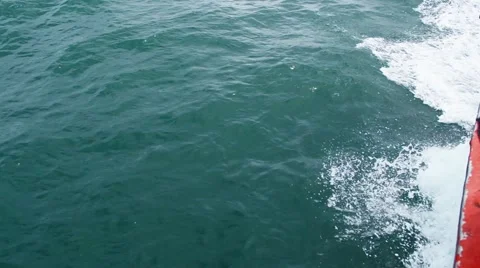 Sailing in the wind through the waves on sunny day in summer with water splas Stock Footage 64126404