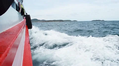 Sailing in the wind through the waves on sunny day in summer with water splas Stock Footage 64126770