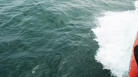 Sailing in the wind through the waves on sunny day in summer with water splas Stock Footage 64126827