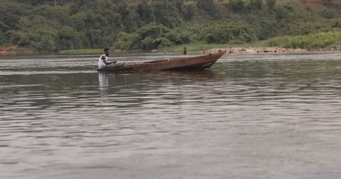 Sailing in a wooden boat at the source of the Nile in Jinja, Uganda South Africa Stock Footage 109491036