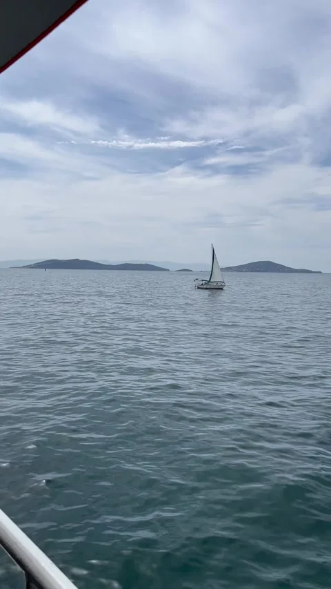Sailing yacht near the islands - vertical Stock Footage 240325853