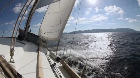 Sailing yacht on the race in blue sea Stock Footage