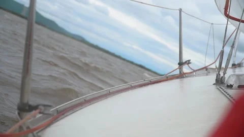 Sailing yacht in rough river waves Stock Footage 304928015