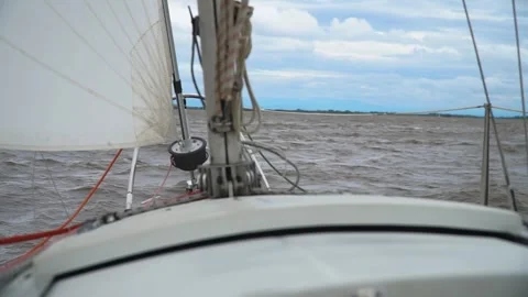 Sailing yacht in rough river waves. Amur river, Russia Stock Footage 304965999