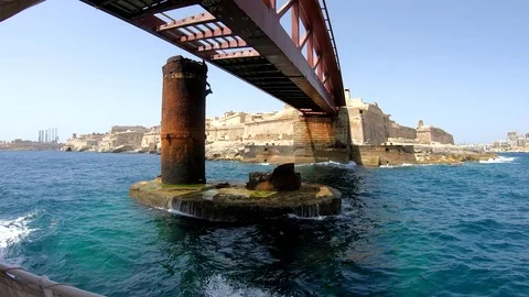 Sailing yacht off shore with beautiful sight of mighty Maltese forts Stock Footage 123727543